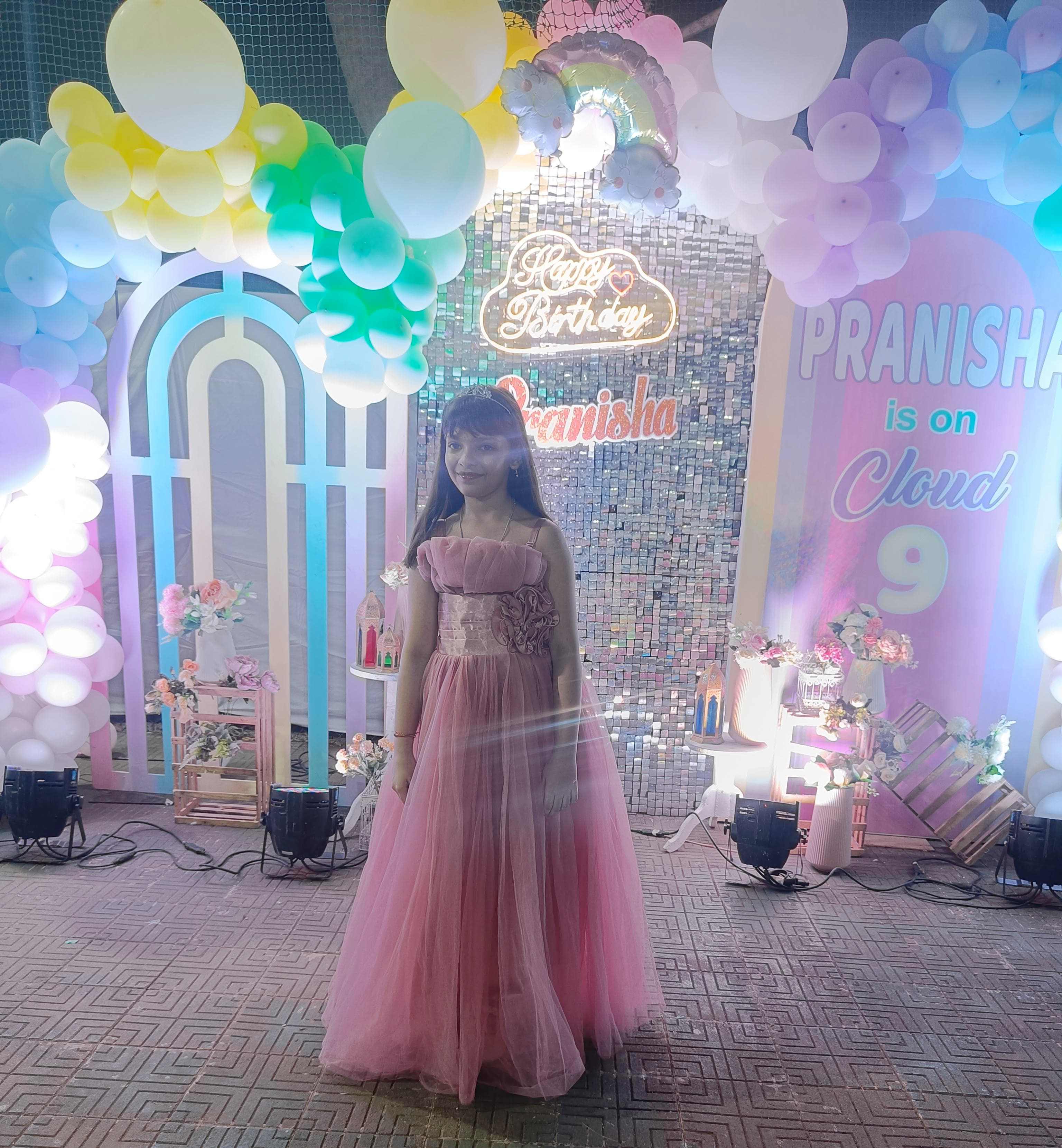 Cloud 9 themed birthday party with neon sign and pastel balloons